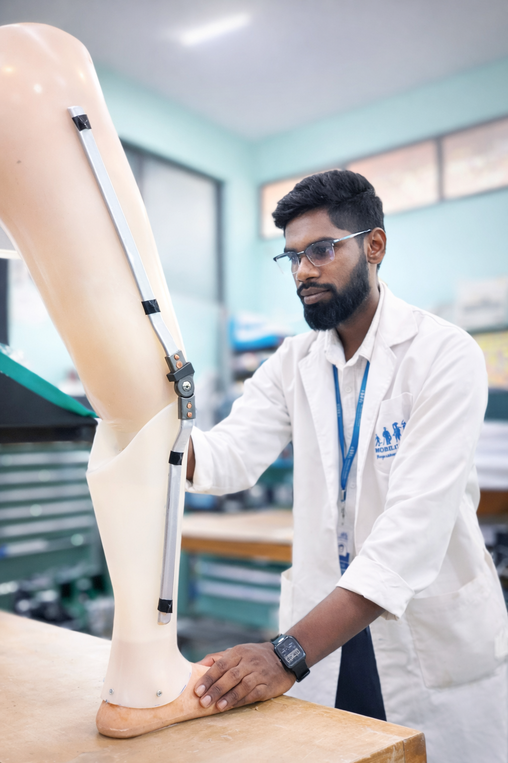 Technician fitting a prosthetic leg